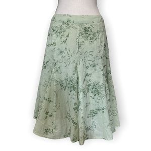 5/$25 or 2/$15 Mid length green floral skirt, size medium